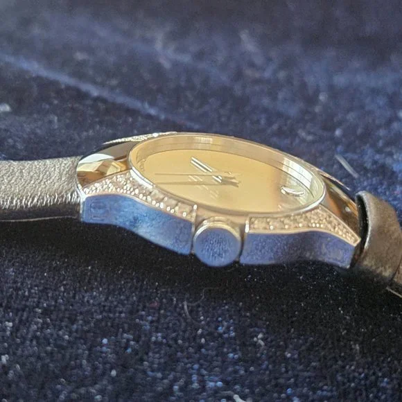 Exquisite, RARE Movado Allia, mirror face with .45 carat diamonds